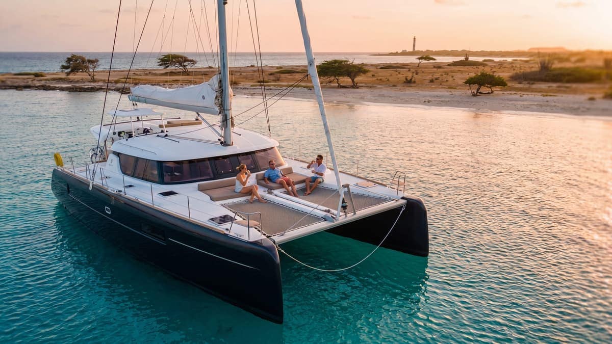 Private yacht anchored in calm turquoise water off Aruba's west coast