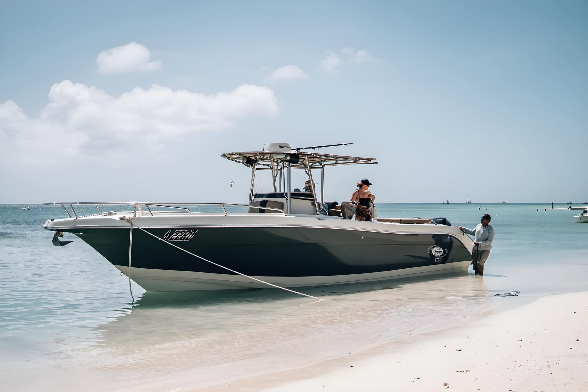 A private charter boat anchored over clear turquoise water off the coast of Aruba