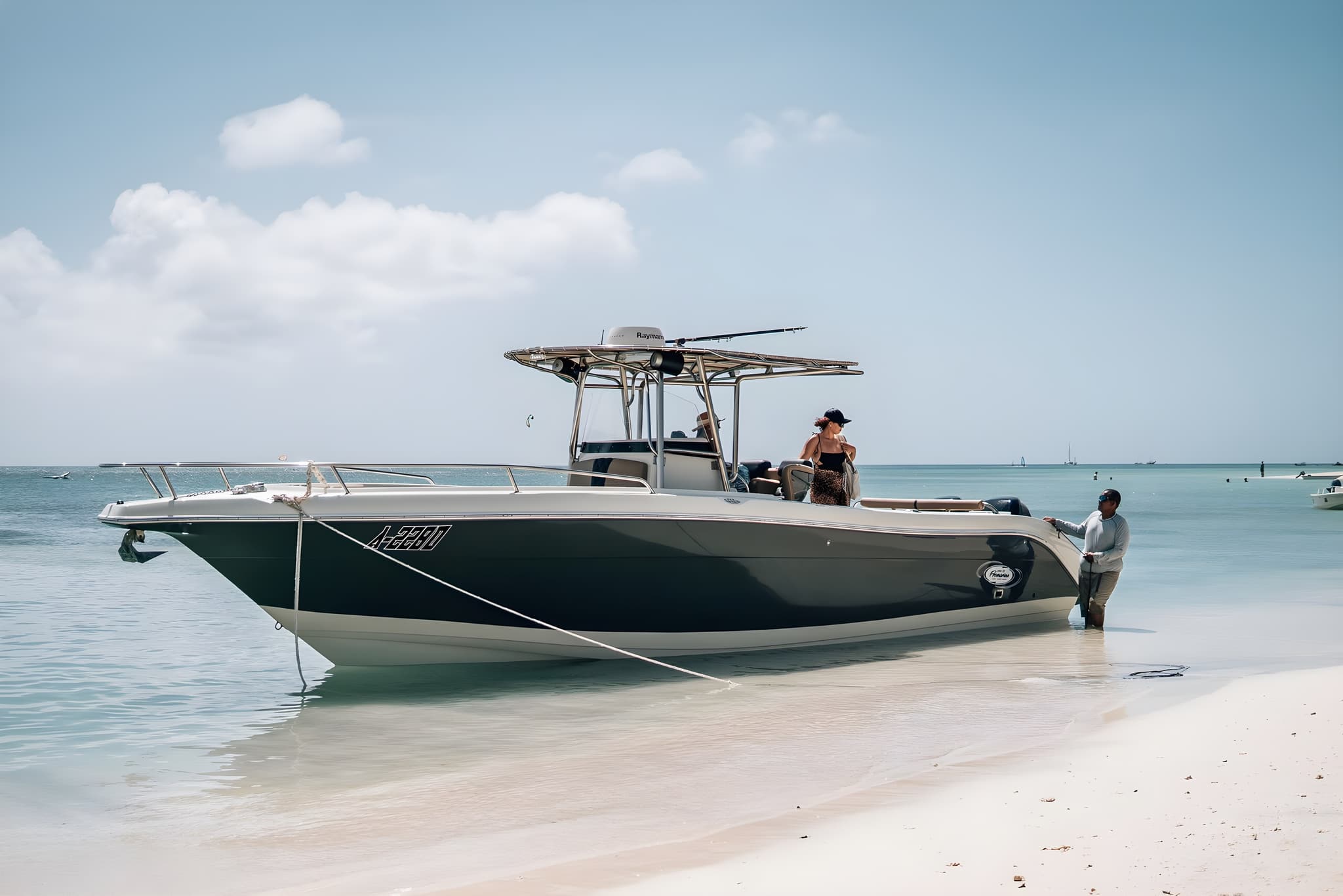 Private boat charter anchored over clear turquoise water in Aruba